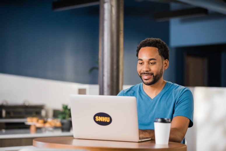 Student sitting at a laptop